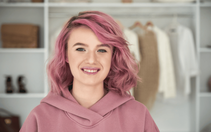 Make your brand stand out - headshot of a woman with pink hair